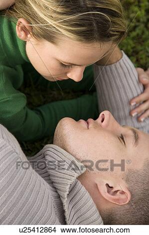 Picture - Two young lovers embracing. Fotosearch
