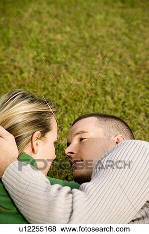 Stock Photo - Two young lovers embracing. Fotosearch