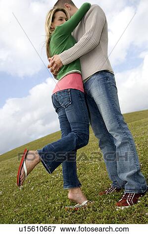 Two young lovers embracing View Large Photo Image Stock Photo - Two young lovers embracing. Fotosearch