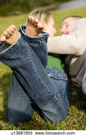Two young lovers embracing View Large Photo Image Stock Photography - Two young lovers embracing. Fotosearch