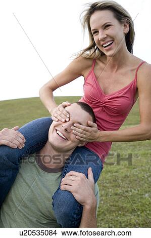 Picture - Two young lovers having fun. Fotosearch