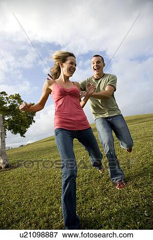 Two young lovers having fun View Large Photo Image Stock Photo - Two young lovers having fun. Fotosearch