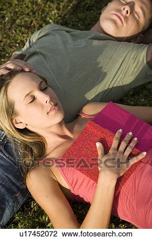 Two young lovers relaxing View Large Photo Image Stock Image - Two young lovers relaxing. Fotosearch