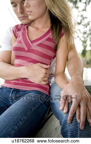 Two young lovers sitting View Large Photo Image Stock Photo - Two young lovers sitting. Fotosearch