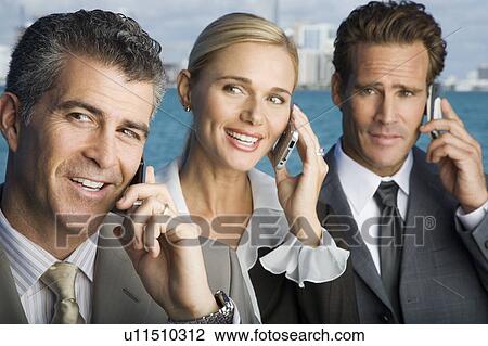 Three business colleagues talking on mobile phones View Large Photo Image Stock Image - Three business colleagues talking on mobile phones. Fotosearch