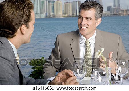 Stock Photography - Two businessman having lunch. Fotosearch