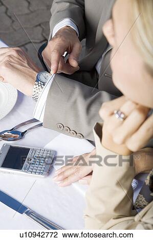 Stock Image - Two colleagues having lunch. Fotosearch