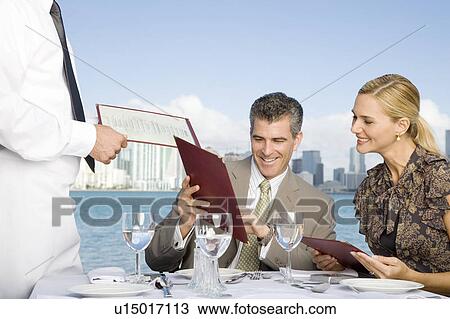 Stock Image - Two colleagues having lunch. Fotosearch