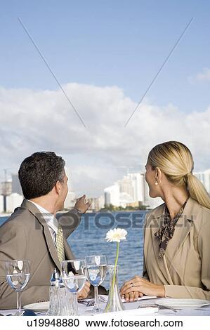 Stock Image - Two colleagues having lunch. Fotosearch