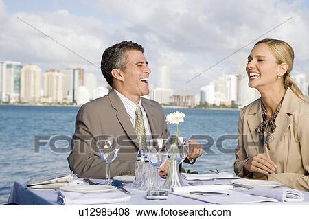 Stock Photo - Two colleagues having lunch. Fotosearch