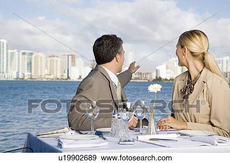 Stock Photo - Two colleagues having lunch. Fotosearch
