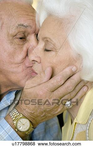 An elderly couple kissing View Large Photo Image Stock Photo - An elderly couple kissing. Fotosearch