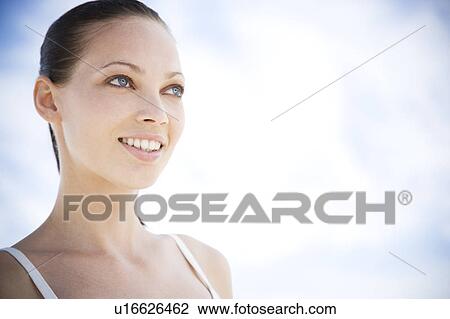 Portrait of a young woman smiling View Large Photo Image Stock Image - Portrait of a young woman smiling. Fotosearch