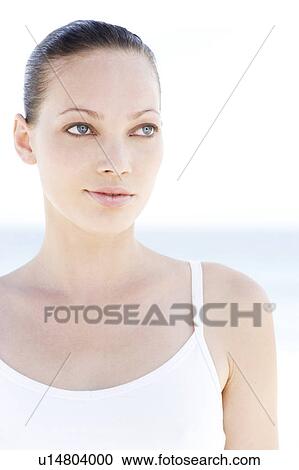 Stock Image - Portrait young woman white vest top. Fotosearch