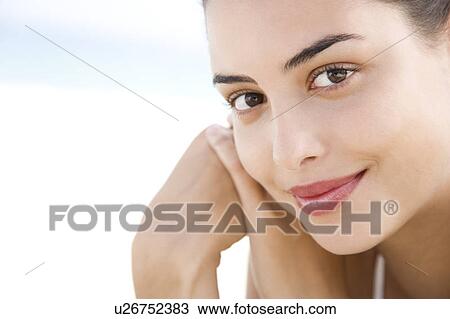 Stock Image - Young woman's face . Fotosearch