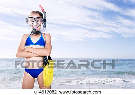 A young girl in snorkeling gear on the beach View Large Photo Image Stock Image - A young girl in snorkeling gear on the beach. Fotosearch