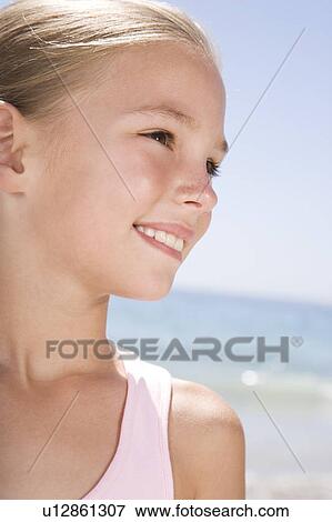 Portrait of a young girl View Large Photo Image Stock Photo - Portrait of a young girl. Fotosearch