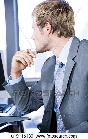 Close up of a businessman looking thoughtful in a modern office View Large Photo Image Stock Photo - Close up of a businessman looking thoughtful in a modern office. Fotosearch