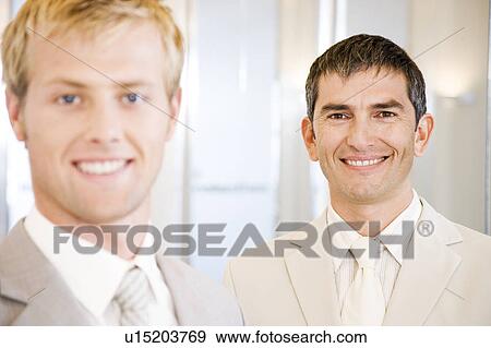 Two smiling businessmen View Large Photo Image Stock Photo - Two smiling businessmen. Fotosearch