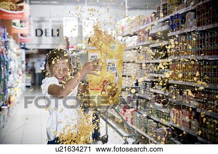 Naughty young girl emptying cereal packet in a supermarket View Large Photo Image Stock Image - Naughty young girl emptying cereal packet in a supermarket. Fotosearch