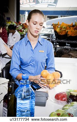 Picture - Portrait of a supermarket checkout assistant. . Fotosearch