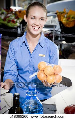 Portrait of a supermarket checkout assistant. View Large Photo Image Stock Image - Portrait of a supermarket checkout assistant. . Fotosearch