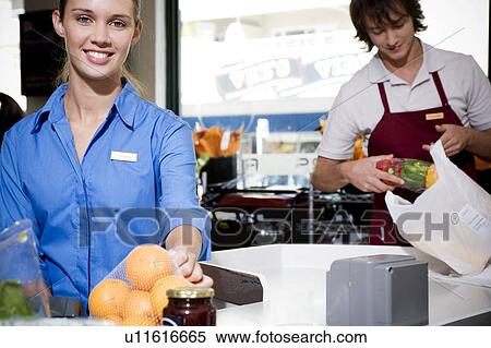 Portrait of supermarket checkout assistants. View Large Photo Image Stock Photography - Portrait of supermarket checkout assistants. . Fotosearch