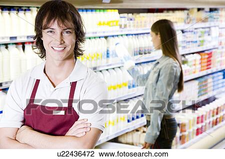 Shop assistant and a customer View Large Photo Image Stock Image - Shop assistant and a customer. Fotosearch