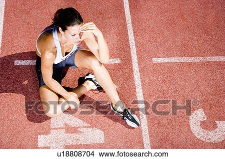 Picture - Portrait of a female athlete resting. Fotosearch