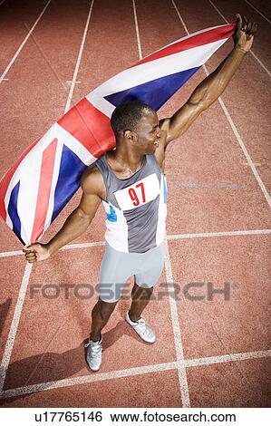 Portrait of a male athlete with UK flag View Large Photo Image Stock Photograph - Portrait of a male athlete with UK flag. Fotosearch