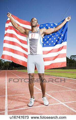 Portrait of a male athlete with US flag View Large Photo Image Stock Image - Portrait of a male athlete with US flag. Fotosearch