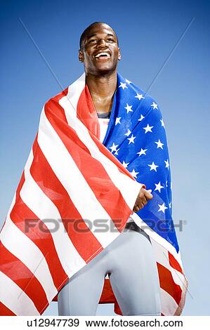 Stock Photo - Portrait of a male athlete with US flag. Fotosearch
