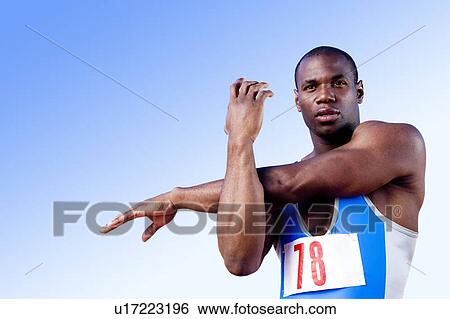 Stock Photograph - Portrait of an athlete warming up. Fotosearch