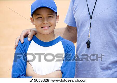 Stock Photo - baseball coach with hand on boy's shoulder. Fotosearch