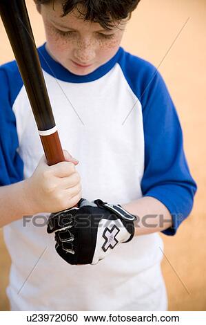 Boy holding baseball bat View Large Photo Image Stock Image - Boy holding baseball bat . Fotosearch
