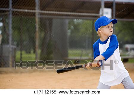 Boy swinging baseball bat View Large Photo Image Stock Photography - Boy swinging baseball bat. Fotosearch