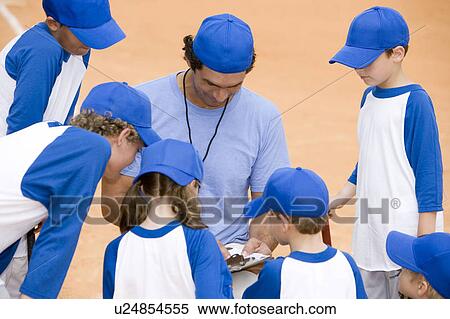 Little league baseball team and coach on pitch View Large Photo Image Stock Photography - Little league baseball team and coach on pitch. Fotosearch