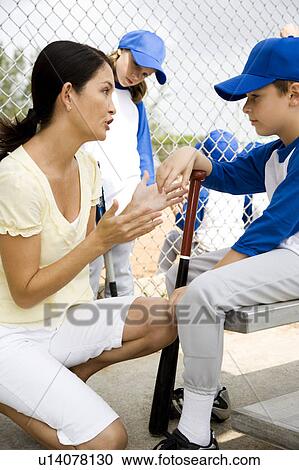 Mother encouraging son at little league baseball game View Large Photo Image Stock Image - Mother encouraging son at little league baseball game. Fotosearch