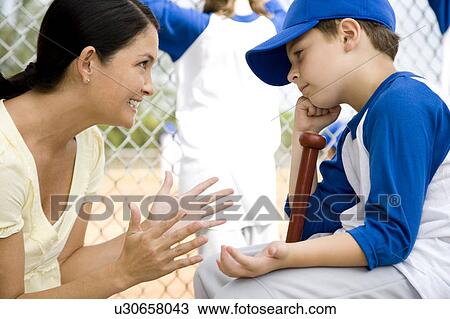 Mother encouraging son at little league baseball game View Large Photo Image Stock Image - Mother encouraging son at little league baseball game. Fotosearch