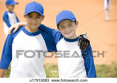 portrait two boys posing for camera at baseball match View Large Photo Image Stock Image - portrait two boys posing for camera at baseball match. Fotosearch