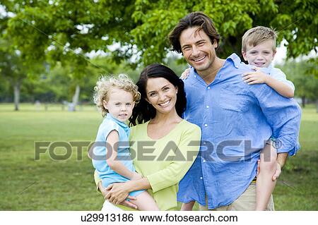 family portrait in park View Large Photo Image Stock Photograph - family portrait in park. Fotosearch