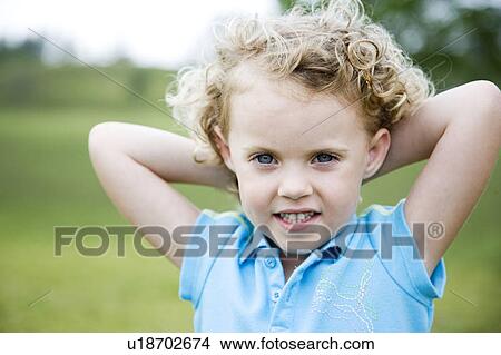 Little girl with hands behind her head View Large Photo Image Picture - Little girl with hands behind her head. Fotosearch