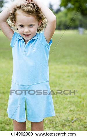 Little girl with hands on her head View Large Photo Image Stock Image - Little girl with hands on her head. Fotosearch