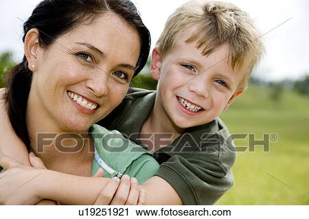 Portrait of mother and son in the park View Large Photo Image Stock Image - Portrait of mother and son in the park. Fotosearch