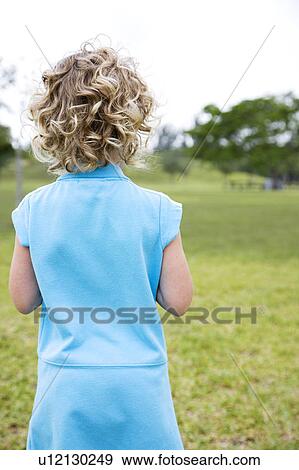 Rear view little girl in the park View Large Photo Image Stock Photo - Rear view little girl in the park. Fotosearch