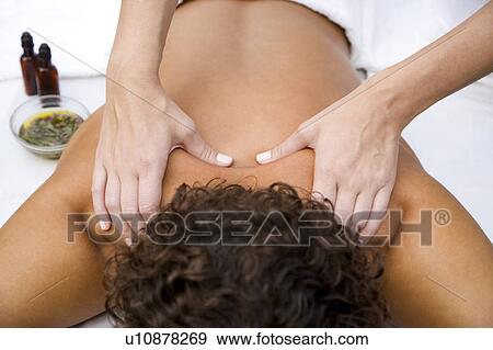 Stock Photo - Man receiving a massage, close up. Fotosearch