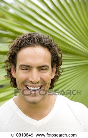 Portrait of a smiling adult man in a tropical garden. View Large Photo Image Stock Photography - Portrait of a smiling adult man in a tropical garden. . Fotosearch