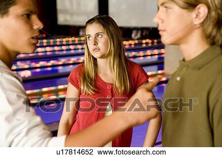 Argument between teenage boys in a bowling alley View Large Photo Image Stock Image - Argument between teenage boys in a bowling alley. Fotosearch