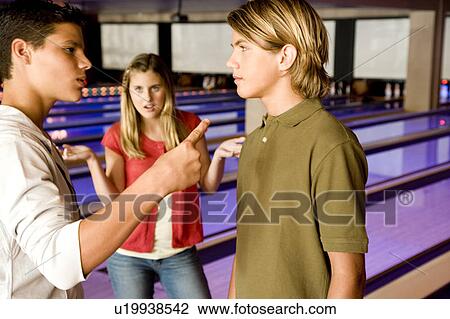 Argument between teenage boys in a bowling alley View Large Photo Image Stock Image - Argument between teenage boys in a bowling alley. Fotosearch