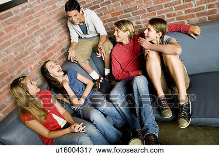 Group of teenage friends at a bowling alley, laughing and joking View Large Photo Image Stock Photo - Group of teenage friends at a bowling alley, laughing and joking. Fotosearch